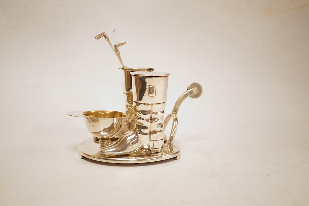 A novelty horse-related cruet stand, a pair of silver mounted horn beakers and three other items